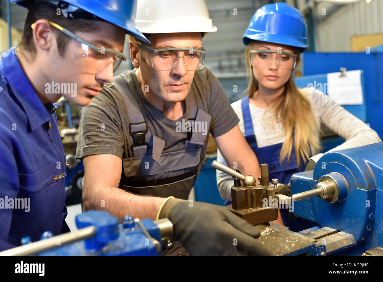 Young people in metallurgy training Stock Photo - Alamy