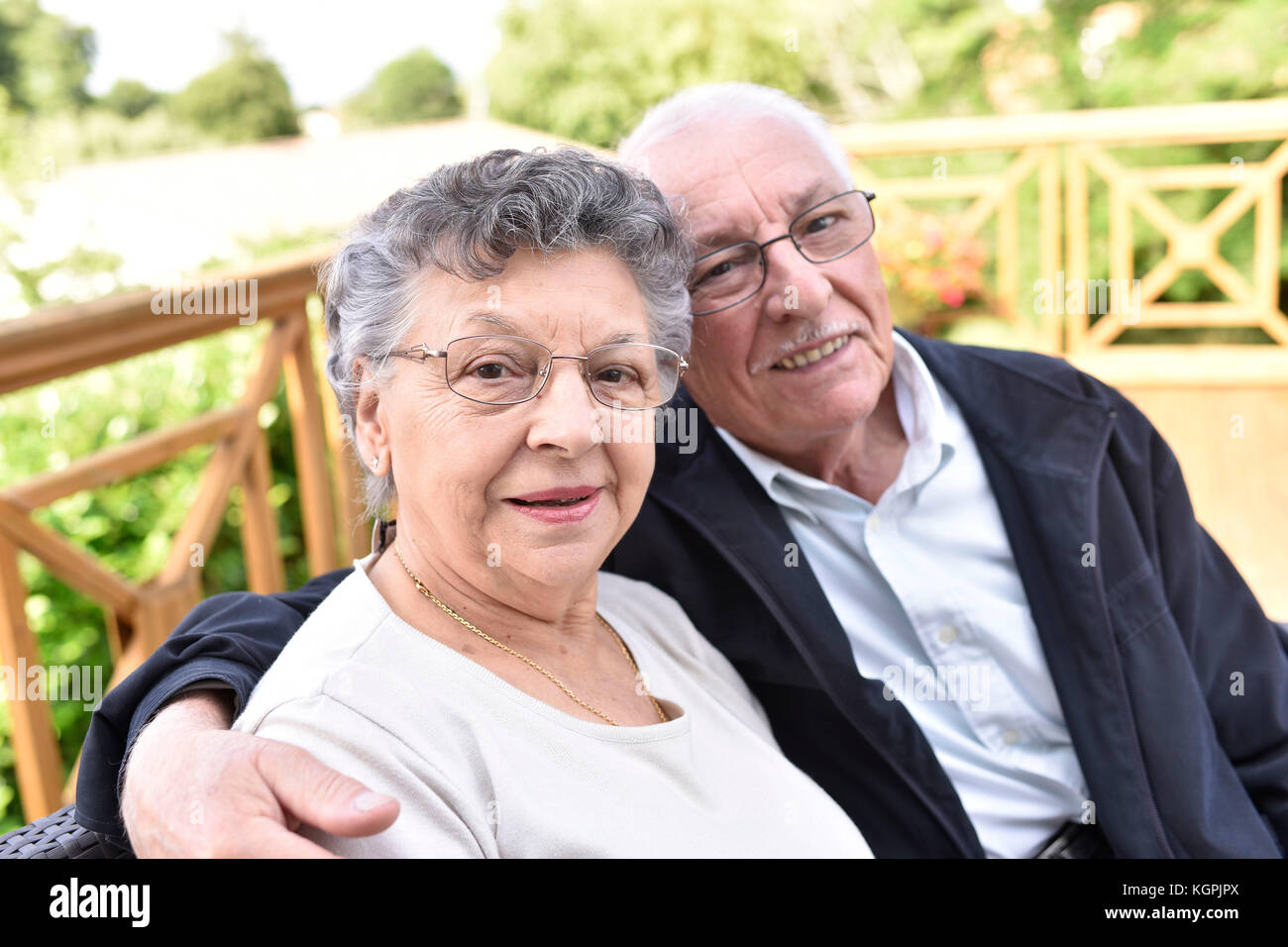 Portrait of elderly couple relaxing outside senior home Stock Photo - Alamy