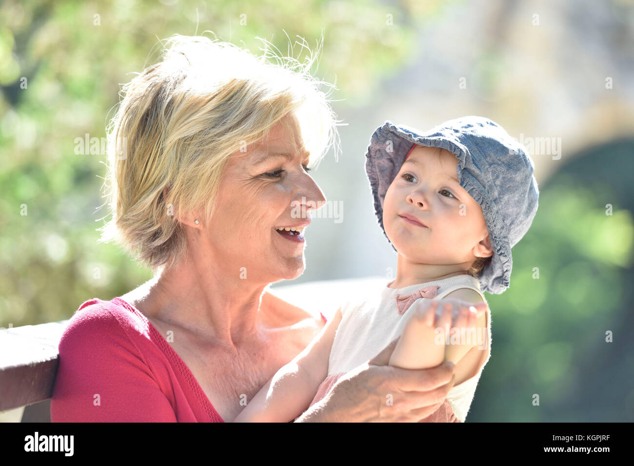 Grandmother enjoying summer day with baby girl Stock Photo