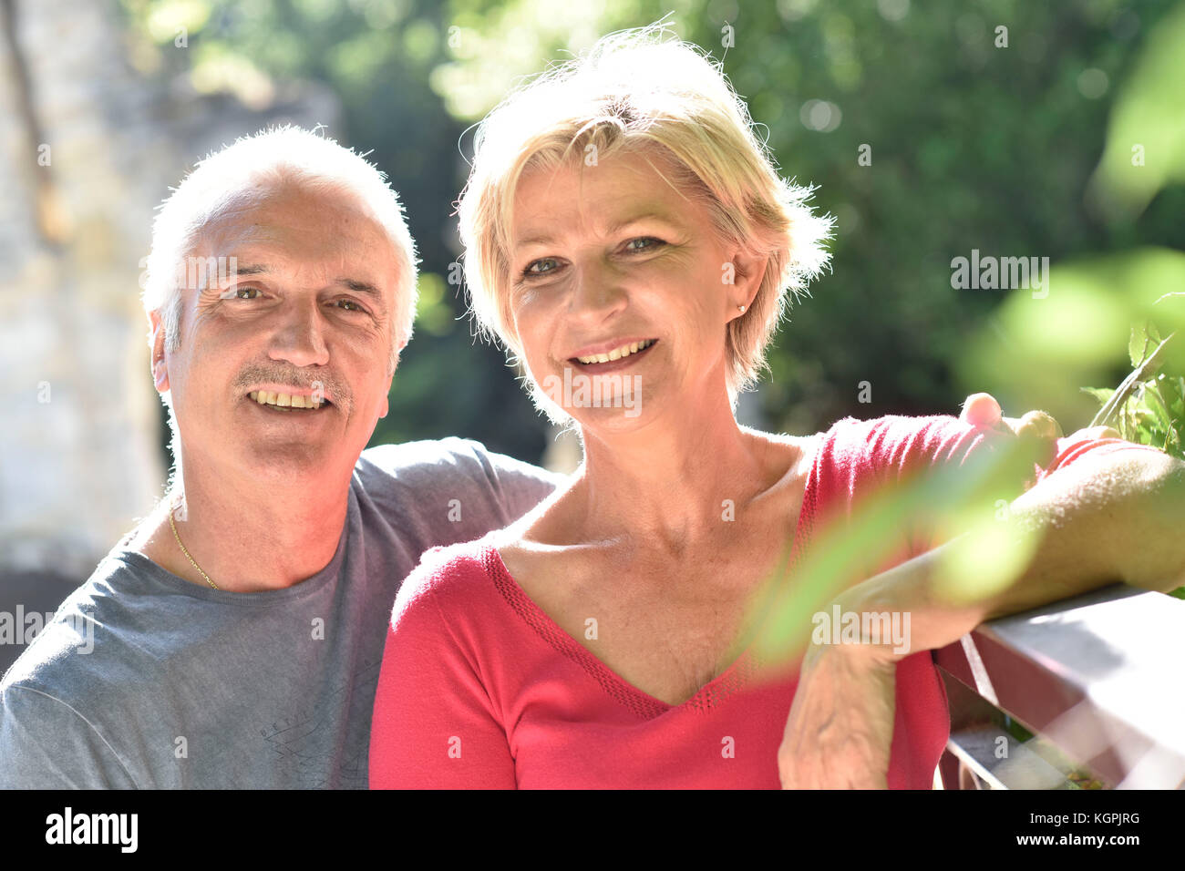Portrait of senior couple in garden Stock Photo - Alamy