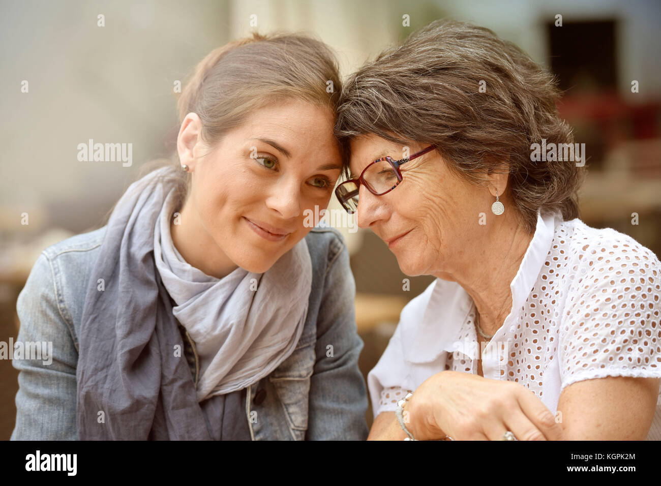 Portrait of elderly woman with home carer Stock Photo