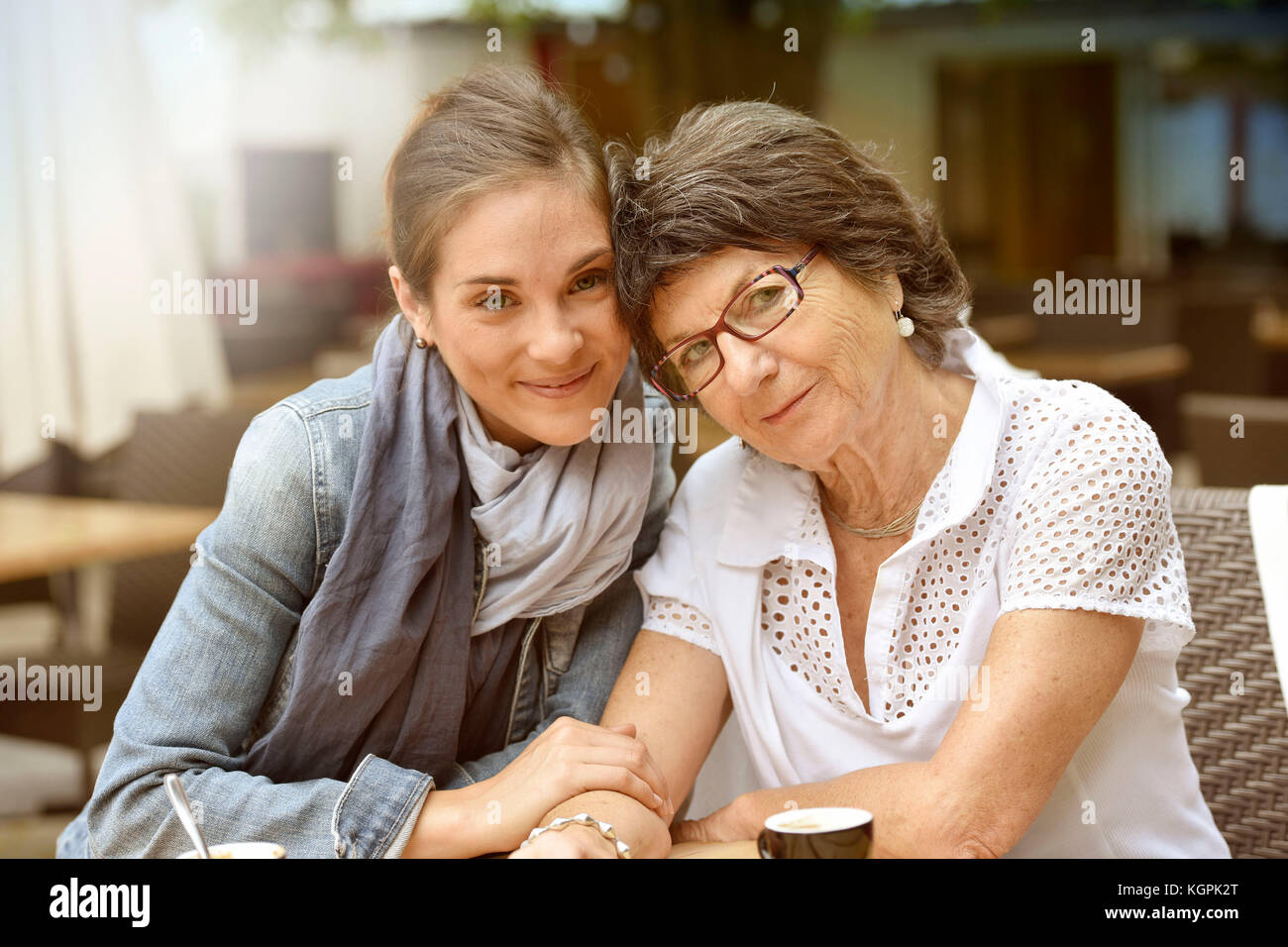 Portrait of elderly woman with home carer Stock Photo