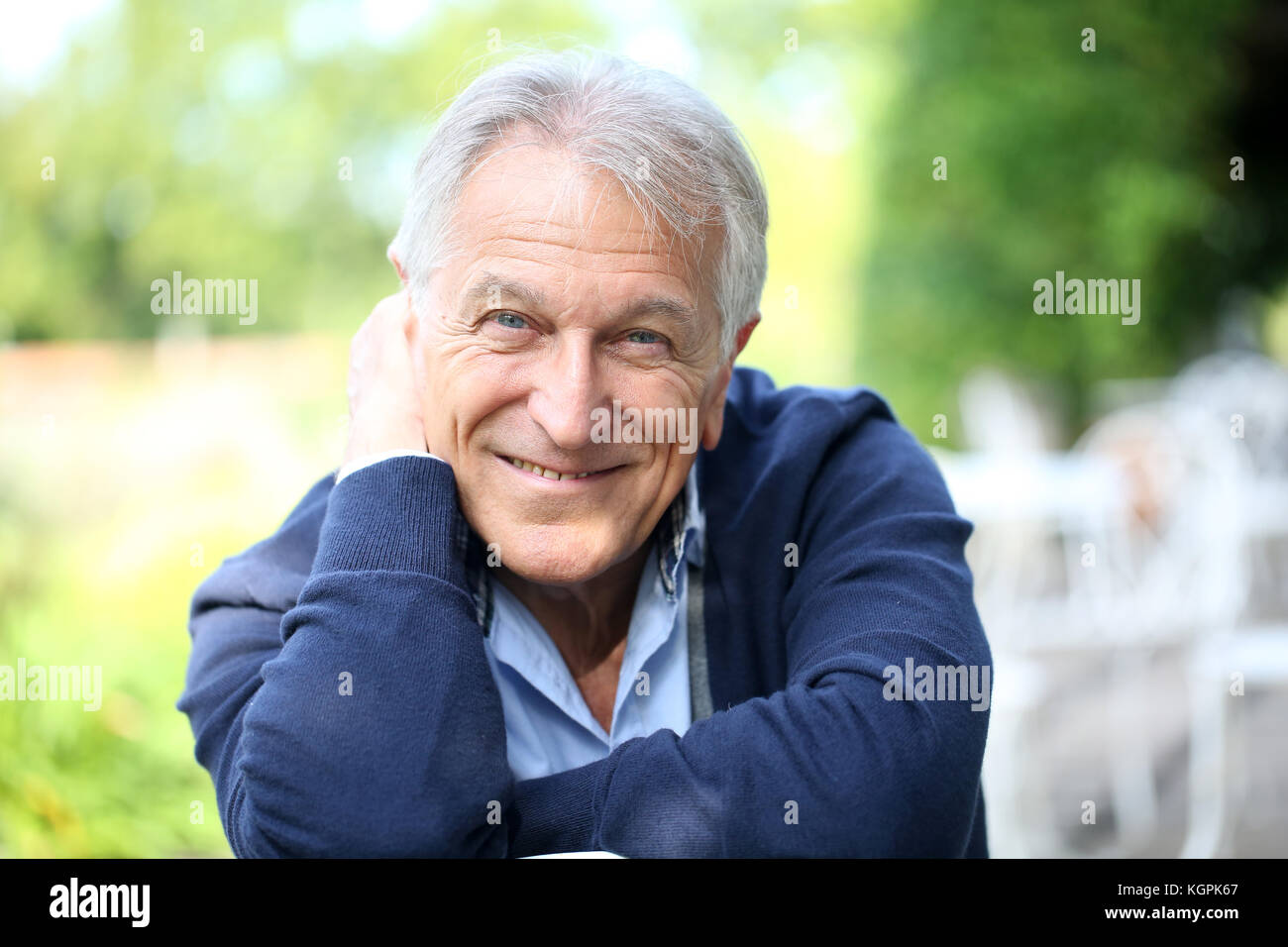 Portrait of senior man sitting hi-res stock photography and images - Alamy