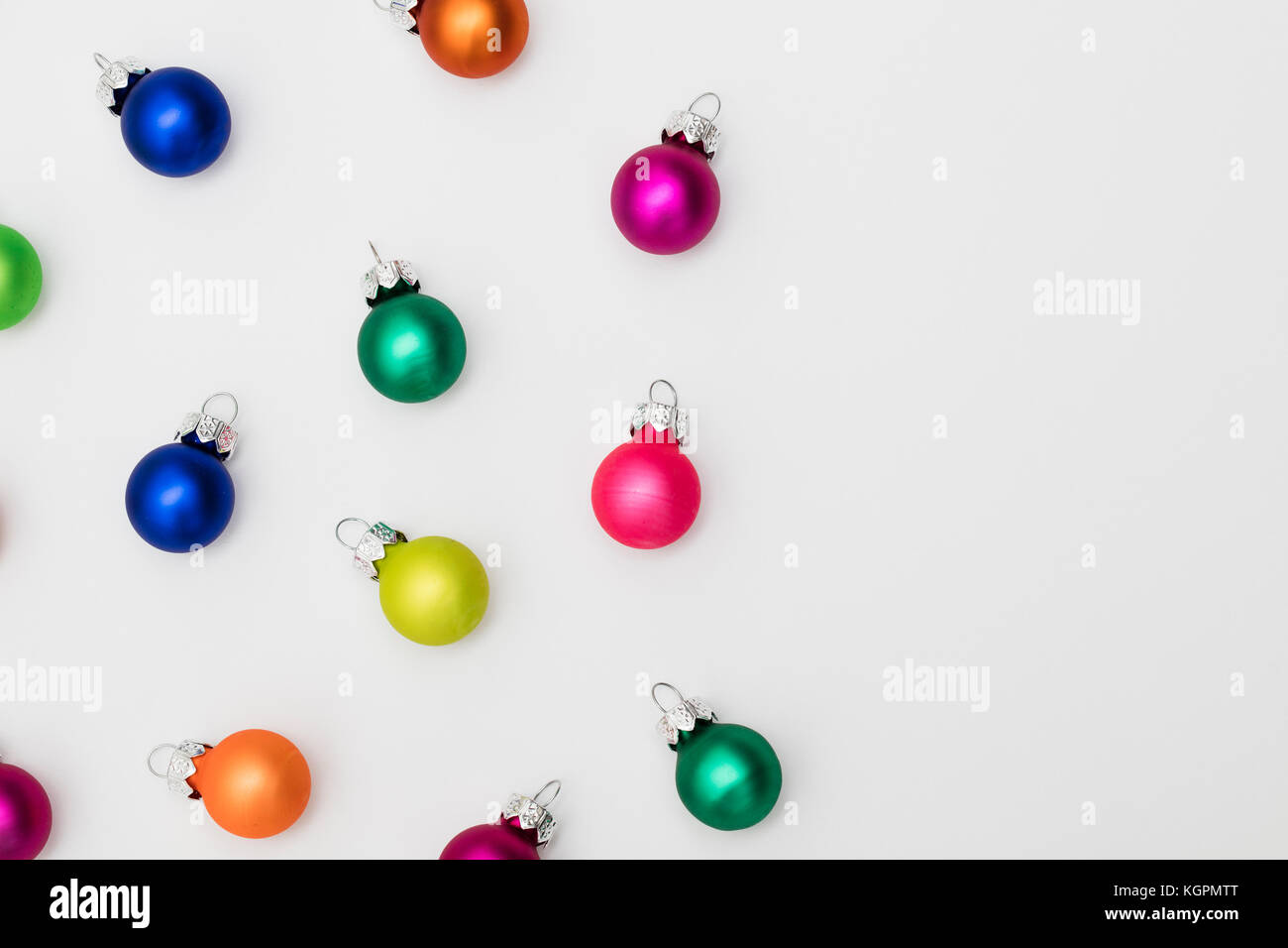 Festive Christmas baubles on a plain white background Stock Photo