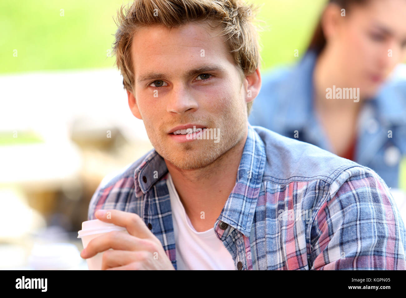 Portrait of smiling student at college campus Stock Photo - Alamy