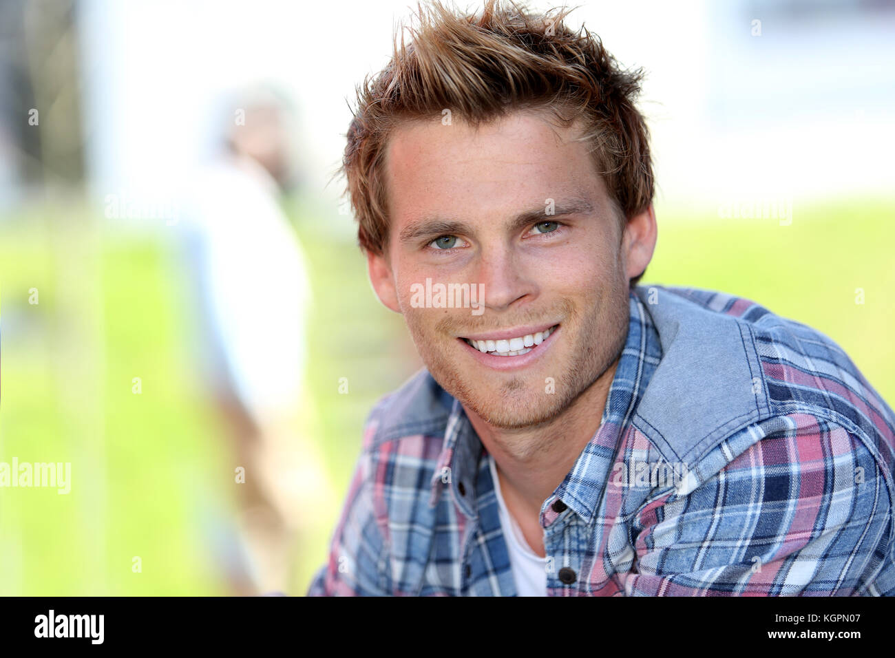 Portrait of smiling student at college campus Stock Photo - Alamy