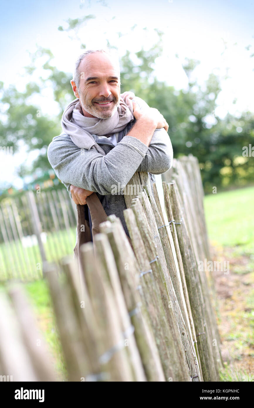 Mature man garden fence hi-res stock photography and images - Alamy