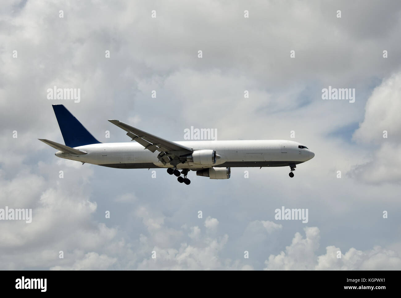 Cargo jet airplane in flight side view Stock Photo