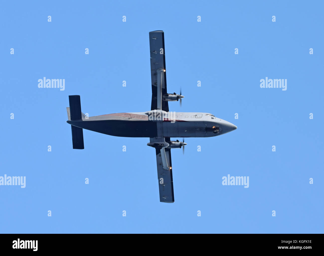 Turboprop cargo airplane seen from below Stock Photo - Alamy