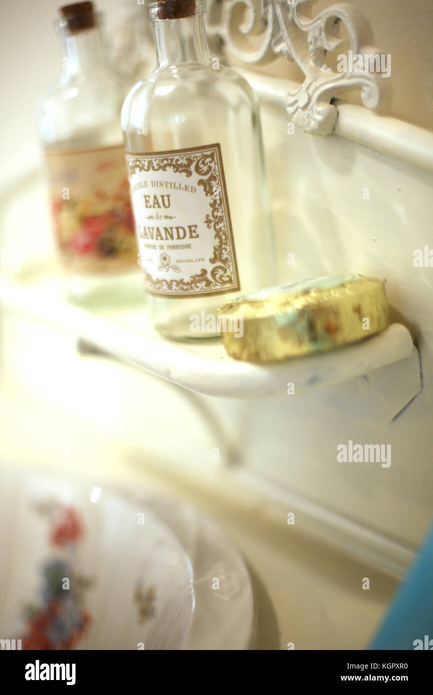 Bottle of fragrance set on bathroom shelf Stock Photo - Alamy