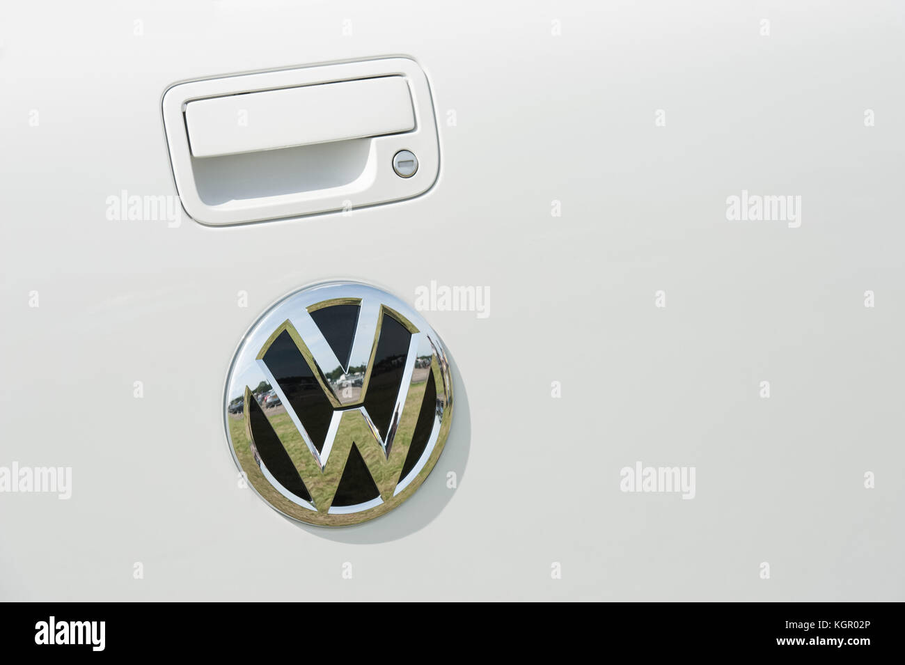 Dunsfold, UK - August 26, 2017: Door panel and manufacturer badge close-up on a Volkswagen automobile at gathering of classic and modern vehicles in D Stock Photo