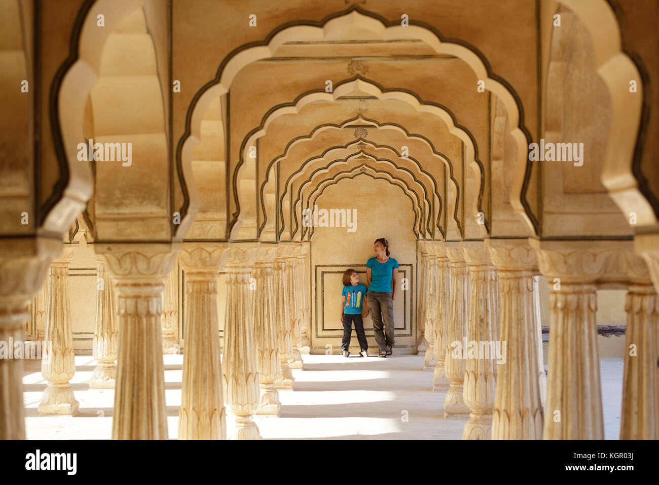 Mother and son standing in the archway at Amer Fort, Jaipur, Rajasthan, India. Stock Photo