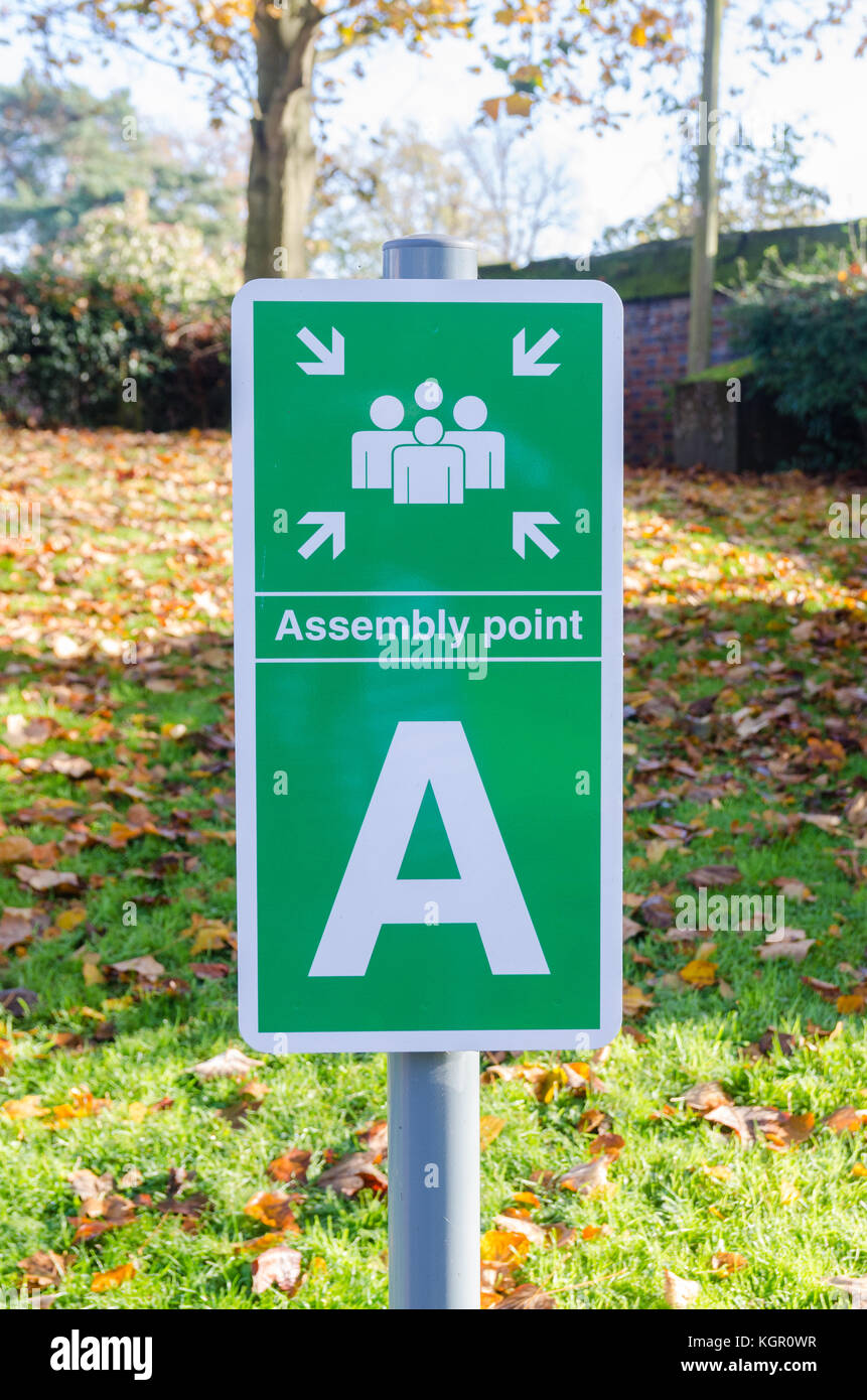 Green sign marking assembly point in the garden behind Warwickshire Yeomanry Museum in Warwick, UK Stock Photo