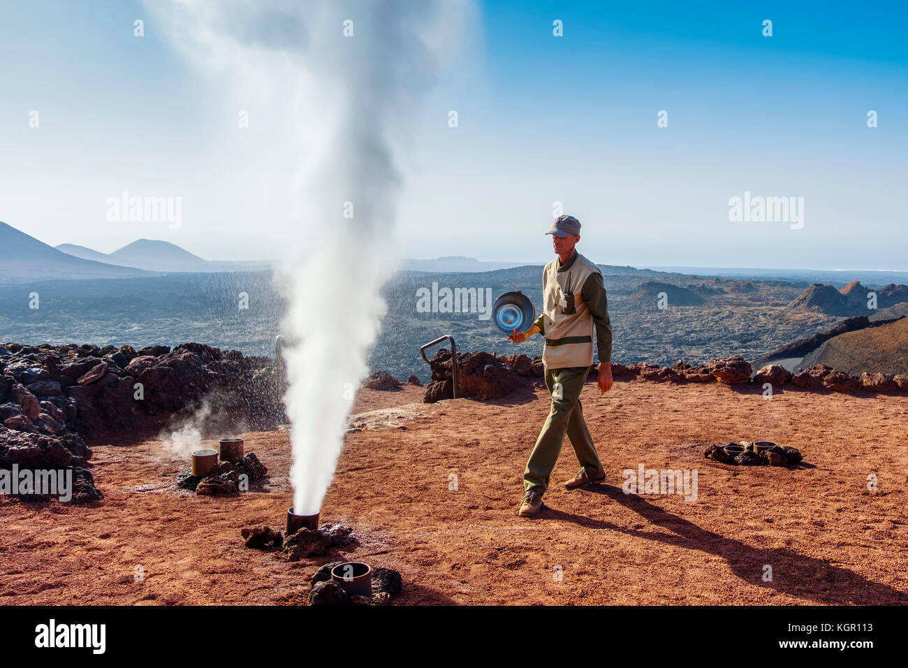 Artificial geyser, demonstrations of volcanic activity on the Islet of Hilario. Timanfaya National Park. Lanzarote Island. Canary Islands Spain. Europ Stock Photo