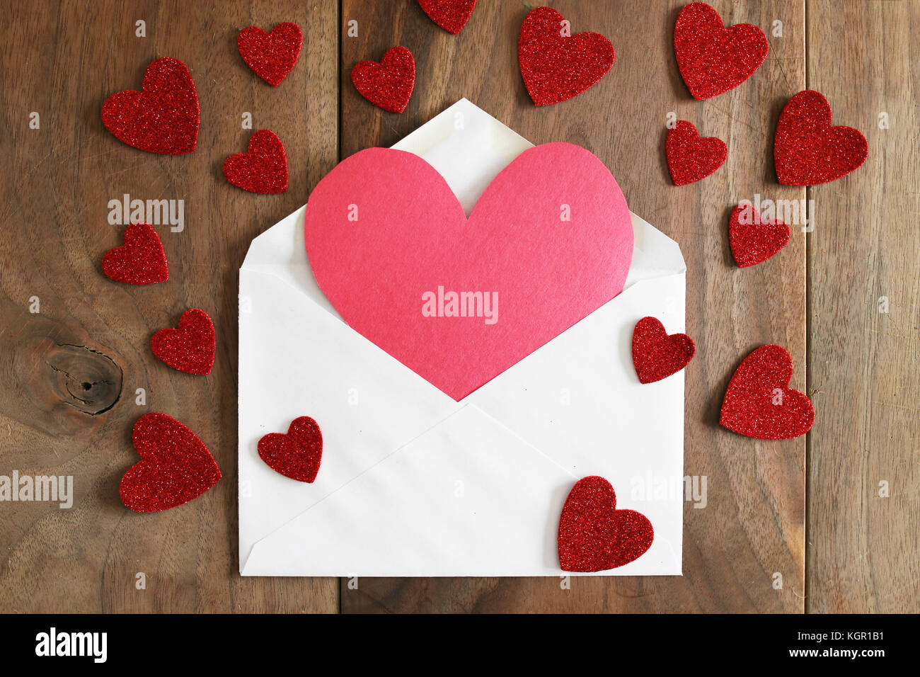 A red, construction paper homemade Valentine's Day card is popping out