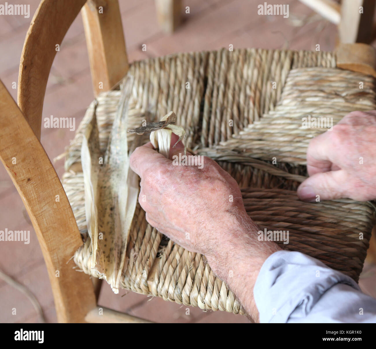 Hand Of An Expert Stuffing Chair At Work Stock Photo 165234020