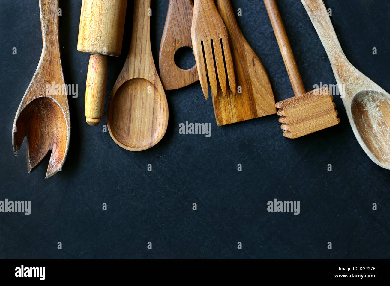A Collection Of Vintage Wooden Cooking Utensils Spoons Rolling Pin Masher Spatula Are Framing The Top Border Of A Black Slate Chalkboard Stock Photo Alamy