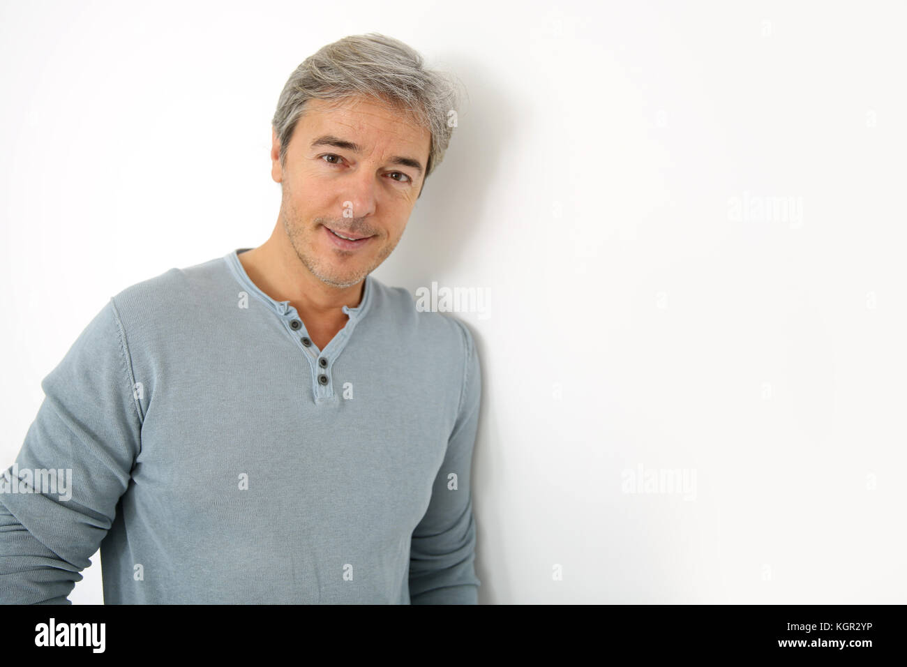 Mature handsome man standing on white background Stock Photo - Alamy