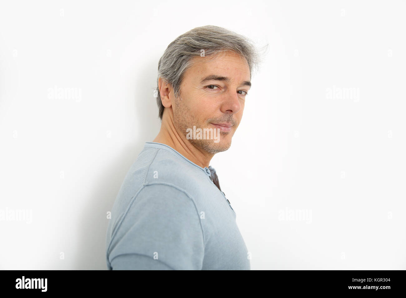 Mature handsome man standing on white background Stock Photo - Alamy