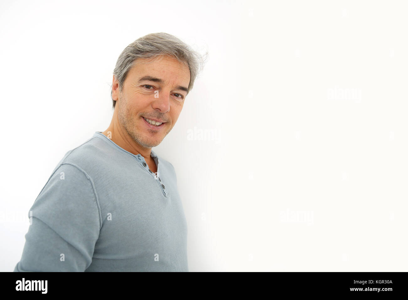 Mature handsome man standing on white background Stock Photo - Alamy
