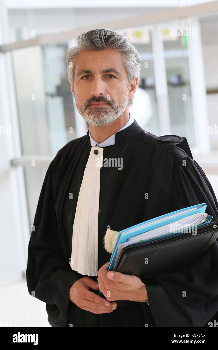 Portrait of lawyer standing in courthouse corrridor Stock Photo