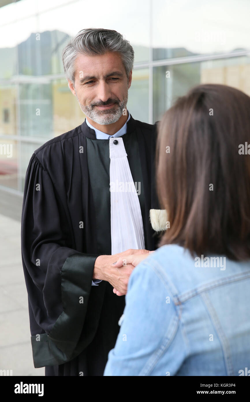 Lawyer meeting client in courthouse before trial Stock Photo Alamy