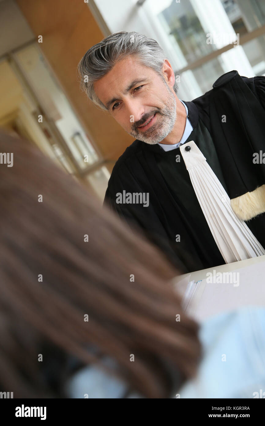 Lawyer meeting client in courthouse before trial Stock Photo Alamy