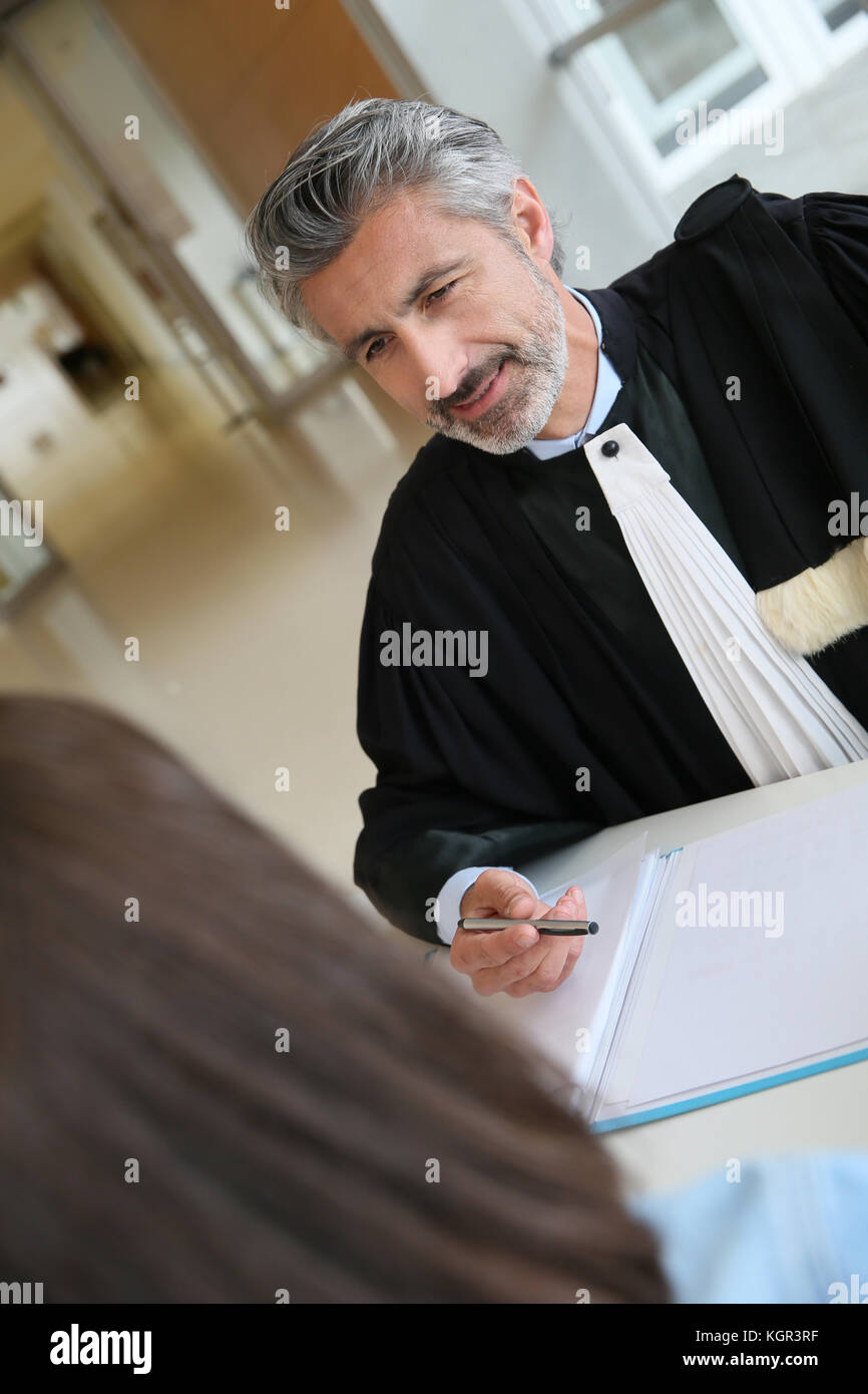 Lawyer meeting client in courthouse before trial Stock Photo Alamy