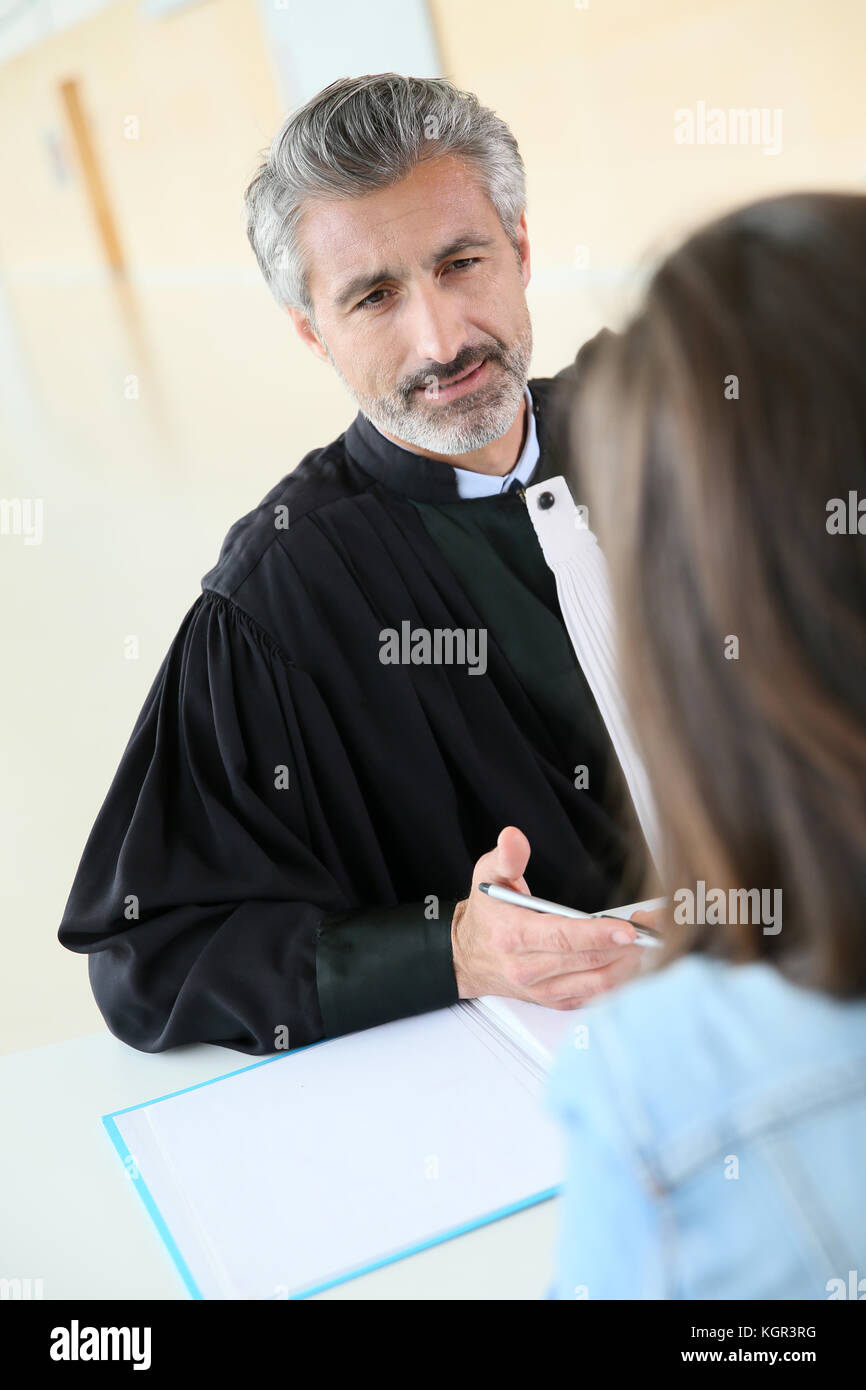 Lawyer meeting client in courthouse before trial Stock Photo Alamy