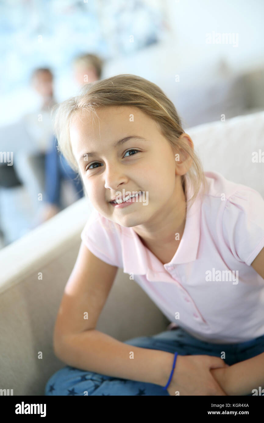 portrait-of-8-year-old-girl-sitting-in-sofa-stock-photo-alamy