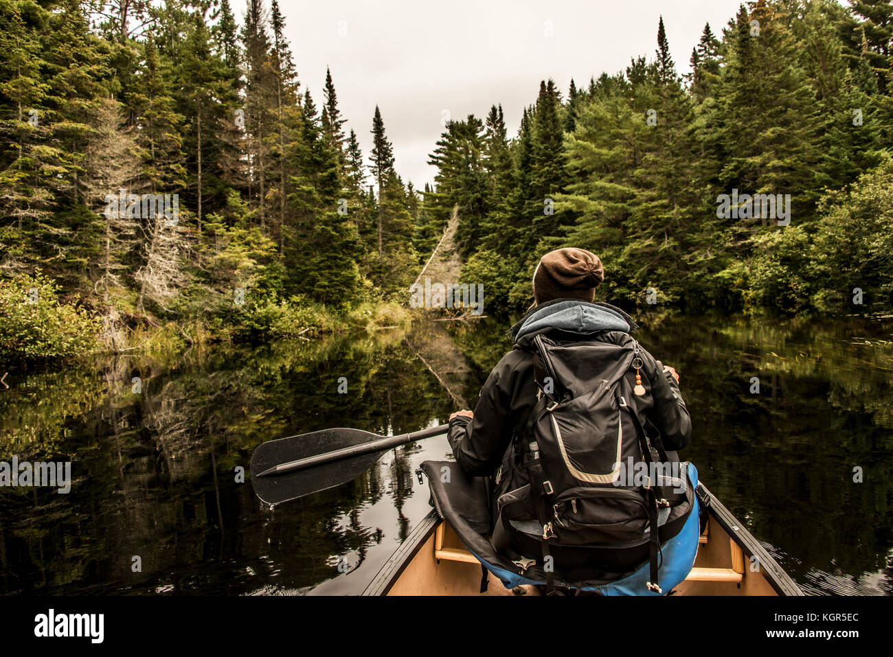 Girl canoeing with Canoe on the lake of two rivers in the algonquin