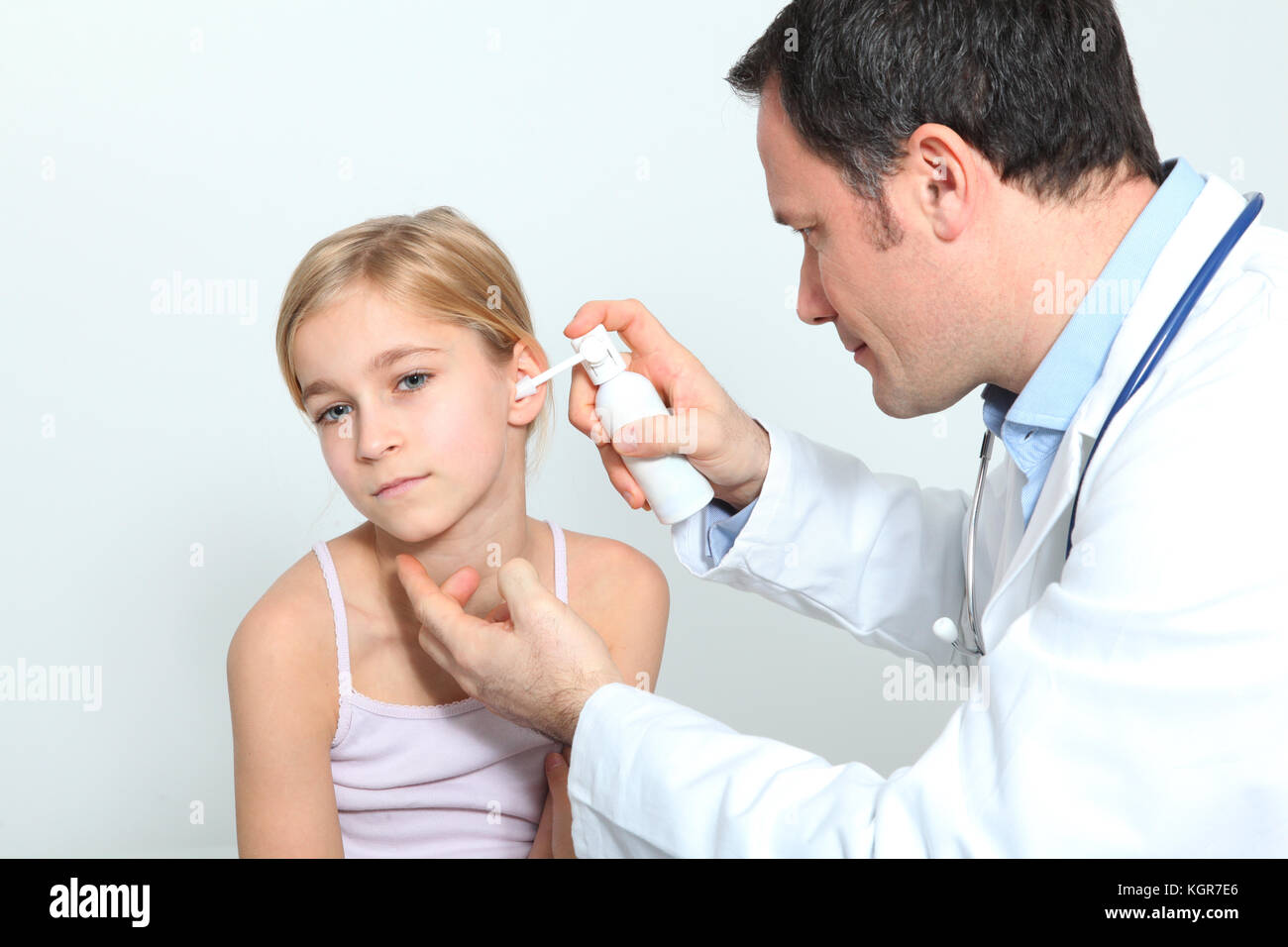 Doctor treating little girl ear infection Stock Photo