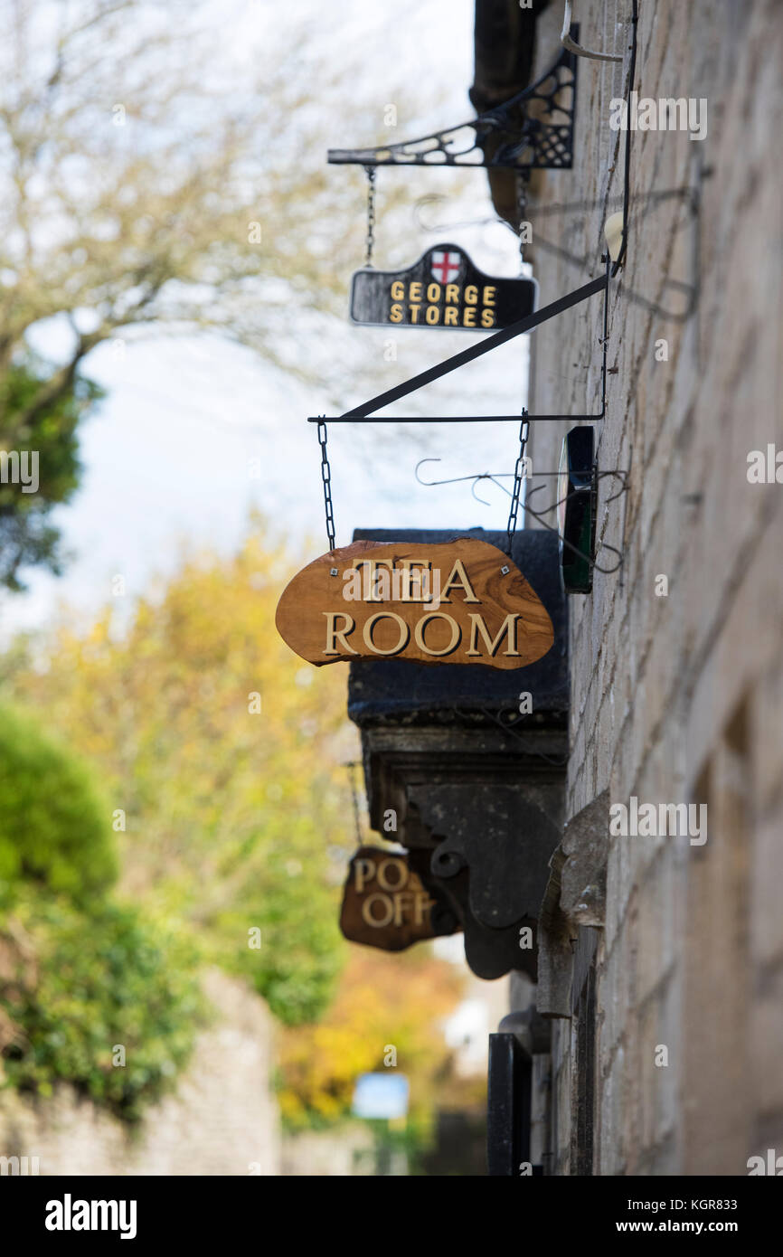 Tea room and post office signs outside the village shop in Bisley, Cotswolds, Gloucestershire, England Stock Photo