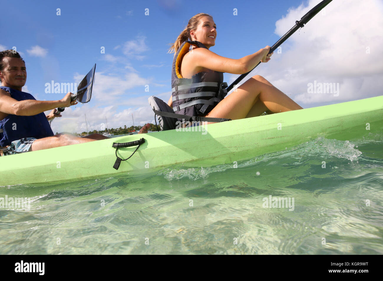 Couple canoeing in transparent caribbean sea Stock Photo Alamy