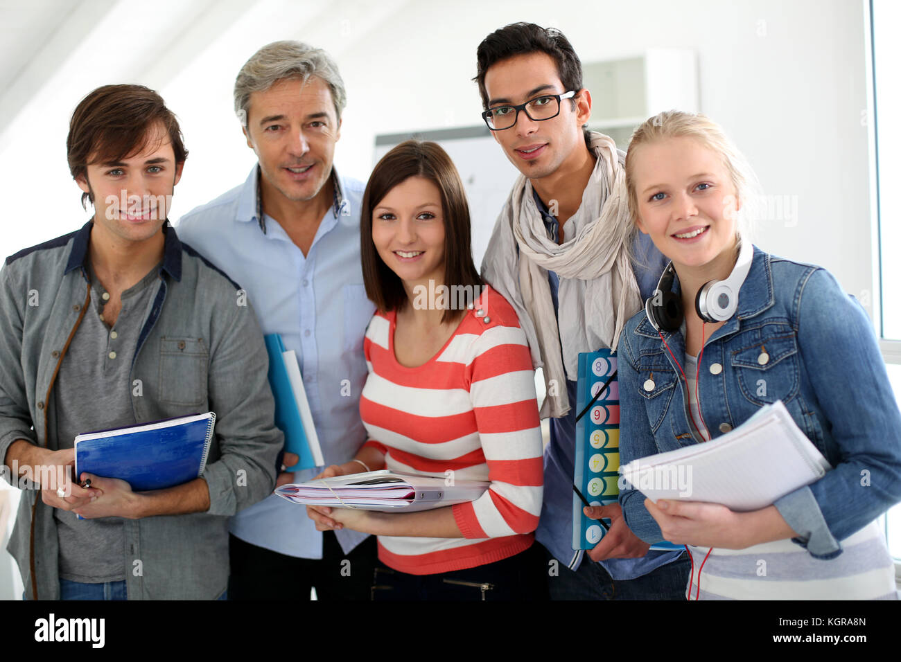Portrait of smiling students with teacher Stock Photo - Alamy