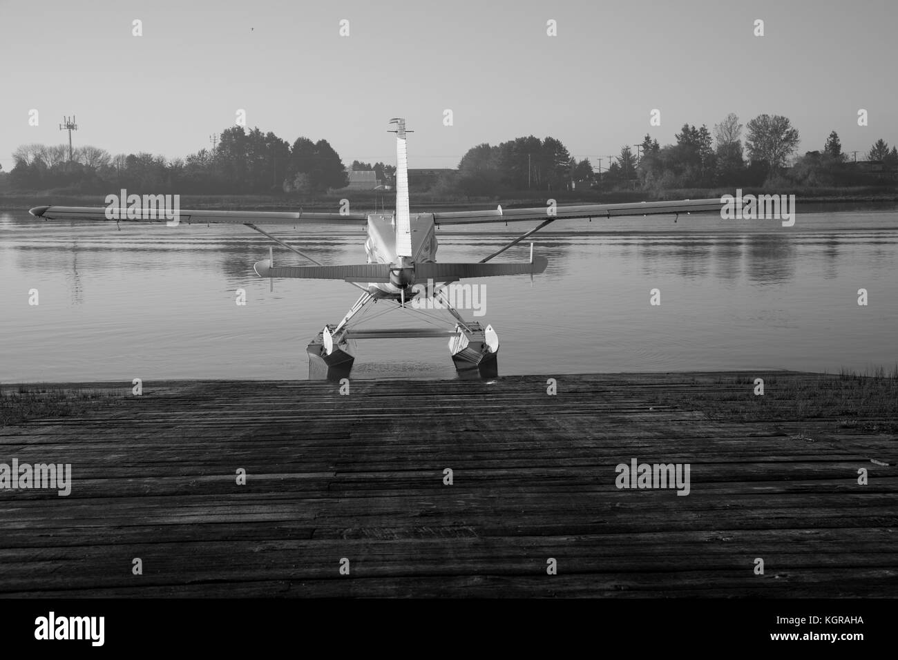 Black and white seaplane ready for flight water background  Stock Photo