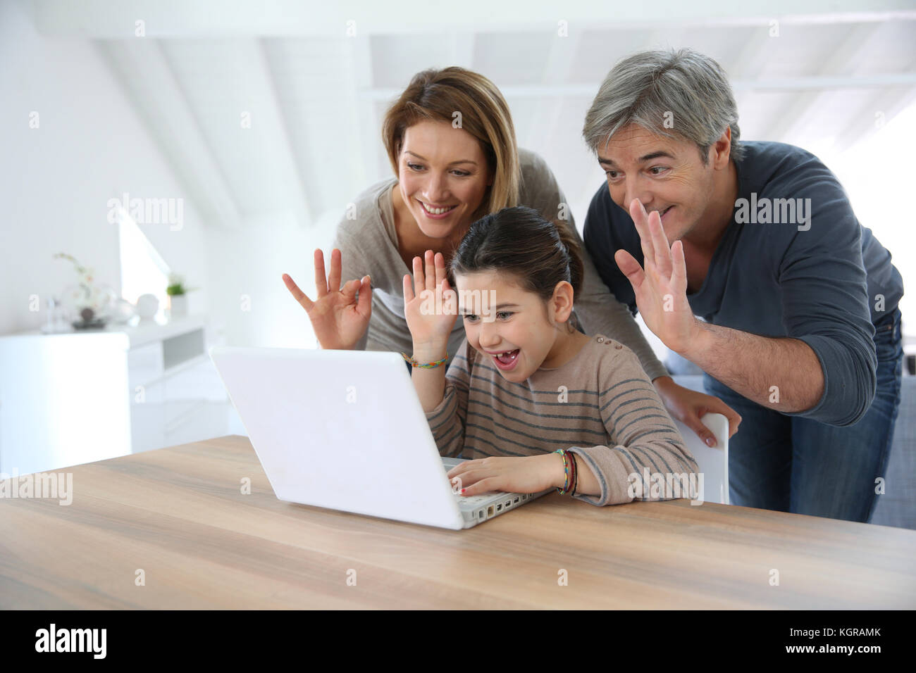 Parents with kids making a distant call on Stock Photo Alamy