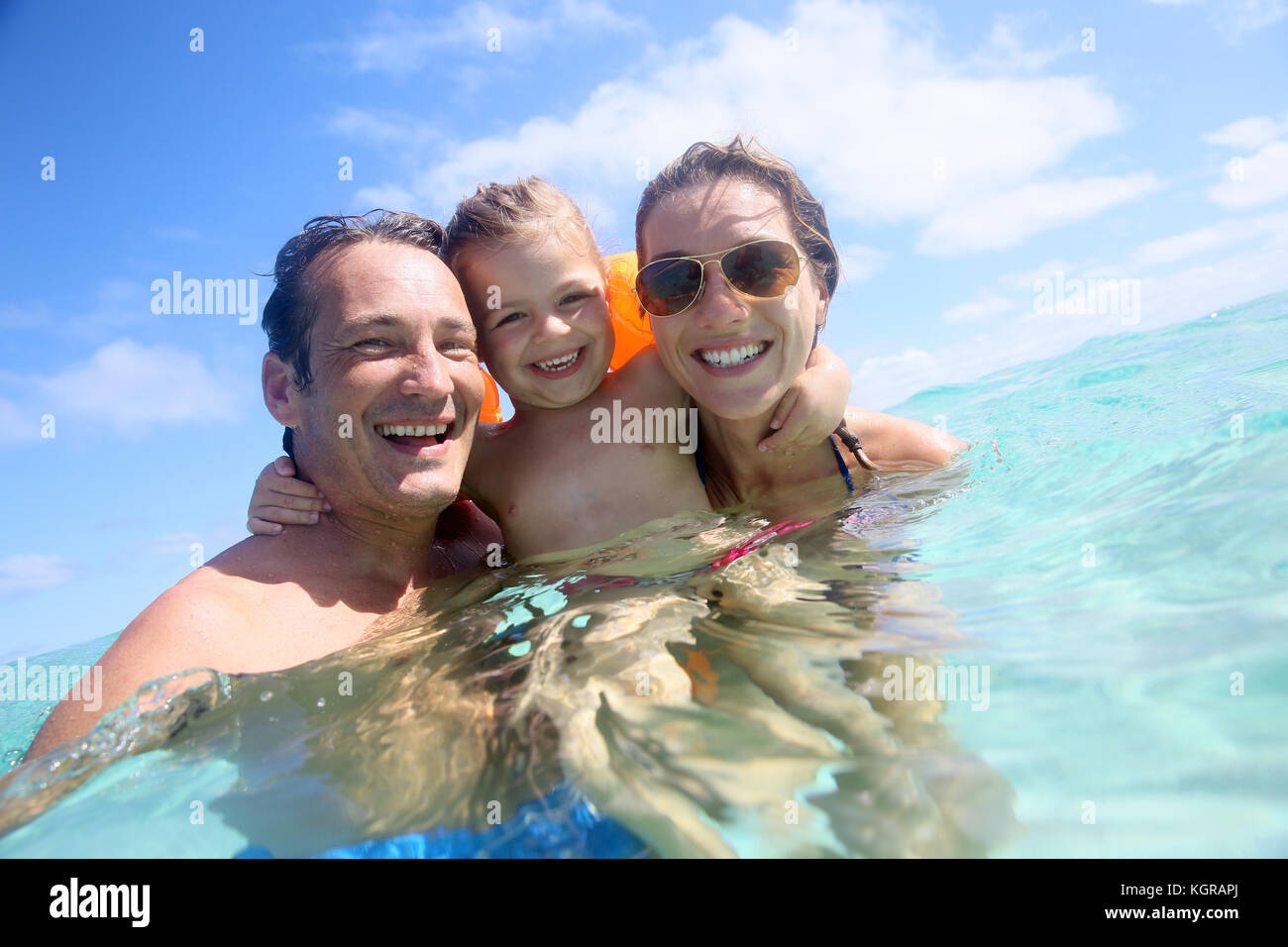 Family enjoying bathing in the sea Stock Photo Alamy