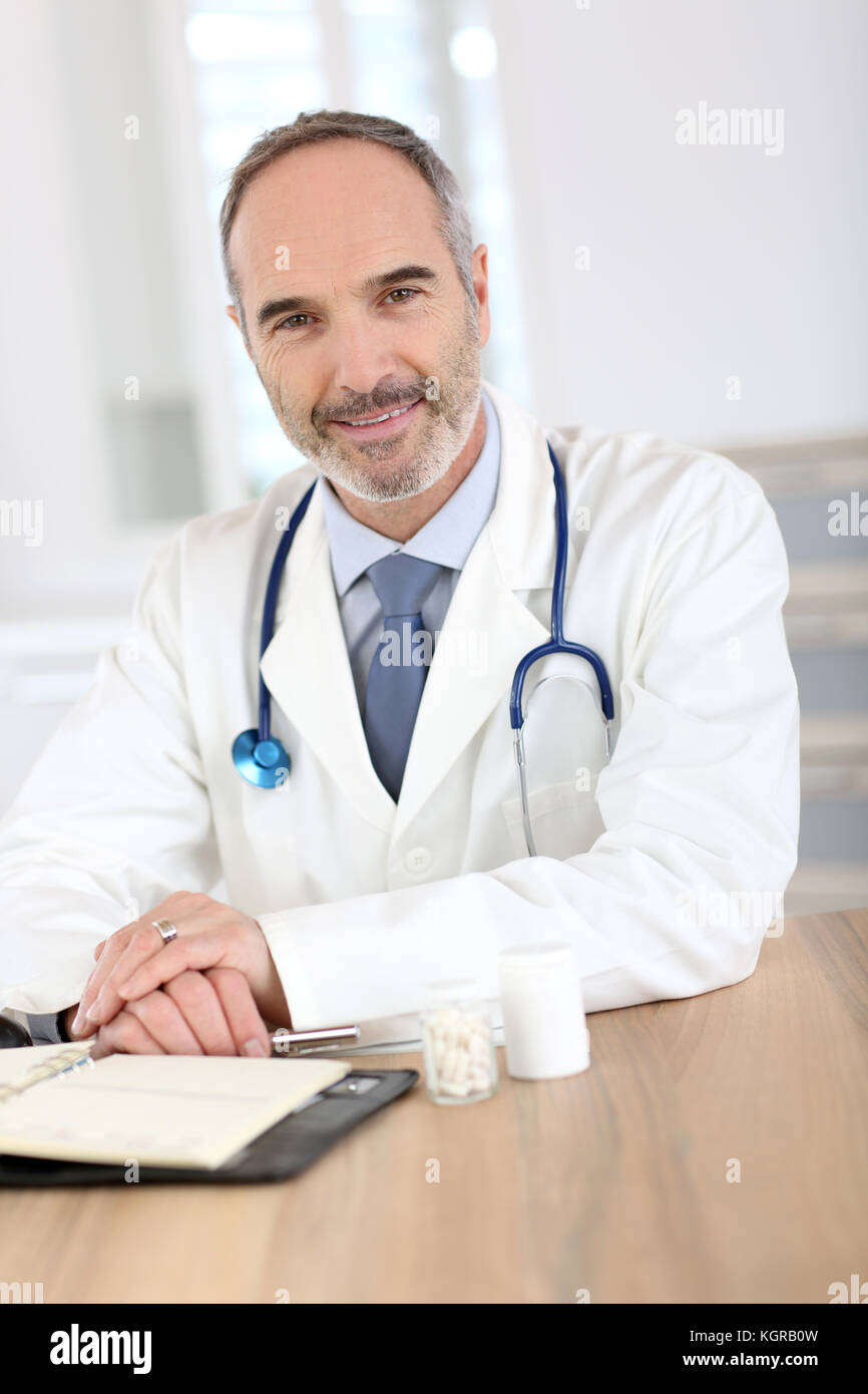 Successful mature doctor in hi-res stock photography and images - Alamy