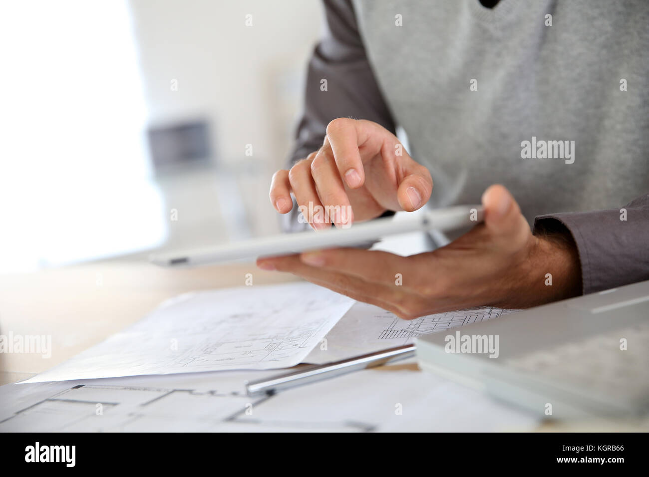Closeup of man's hand using digital tablet Stock Photo - Alamy