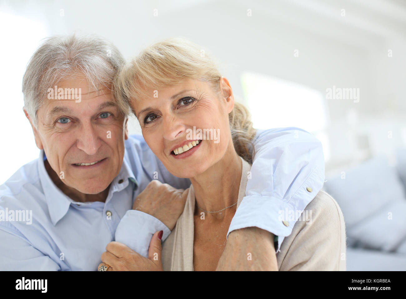 happy senior man embracing his wife Stock Photo