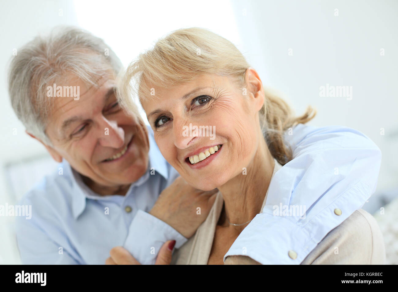 happy senior man embracing his wife Stock Photo