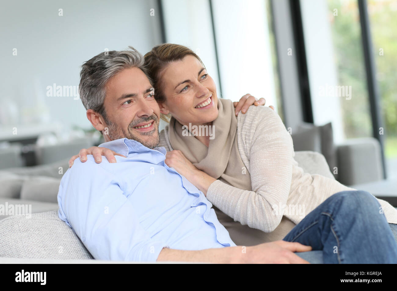 Portrait of mature couple relaxing at home Stock Photo - Alamy