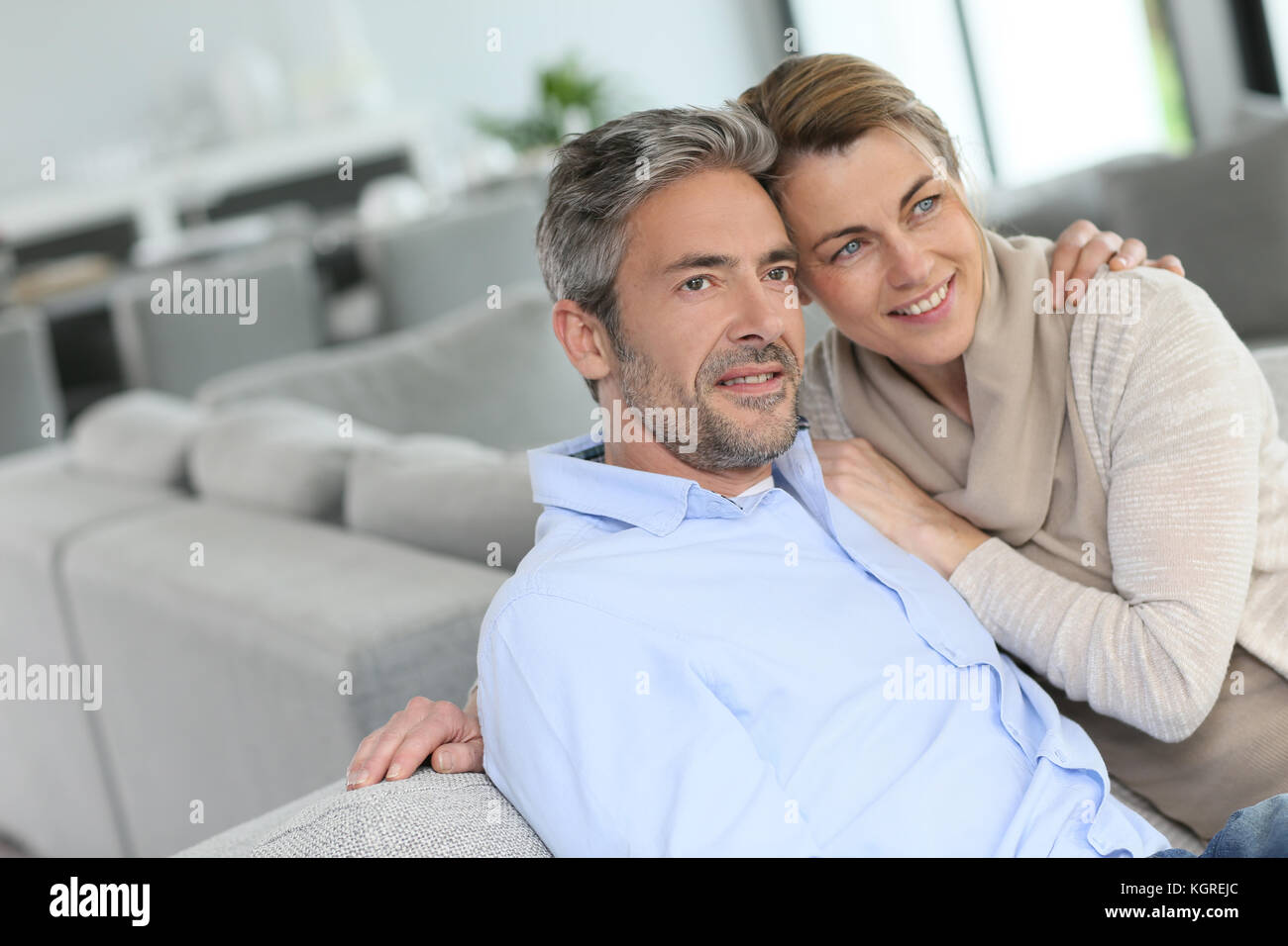 Portrait of mature couple relaxing at home Stock Photo - Alamy