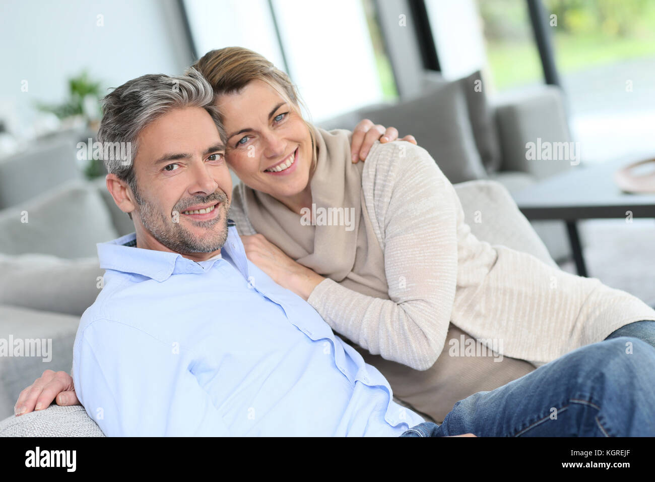 Portrait of mature couple relaxing at home Stock Photo - Alamy