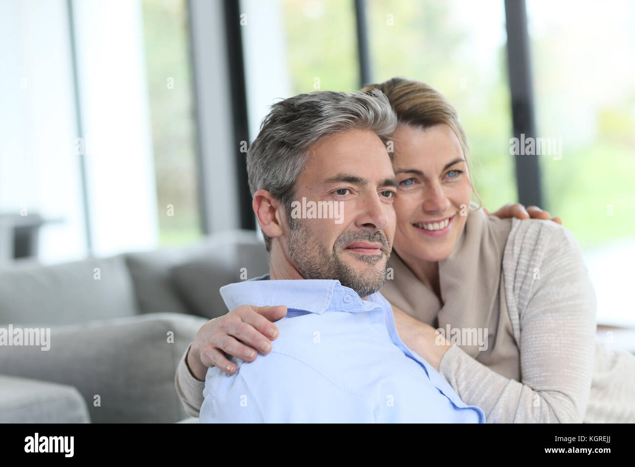 Portrait of mature couple relaxing at home Stock Photo - Alamy