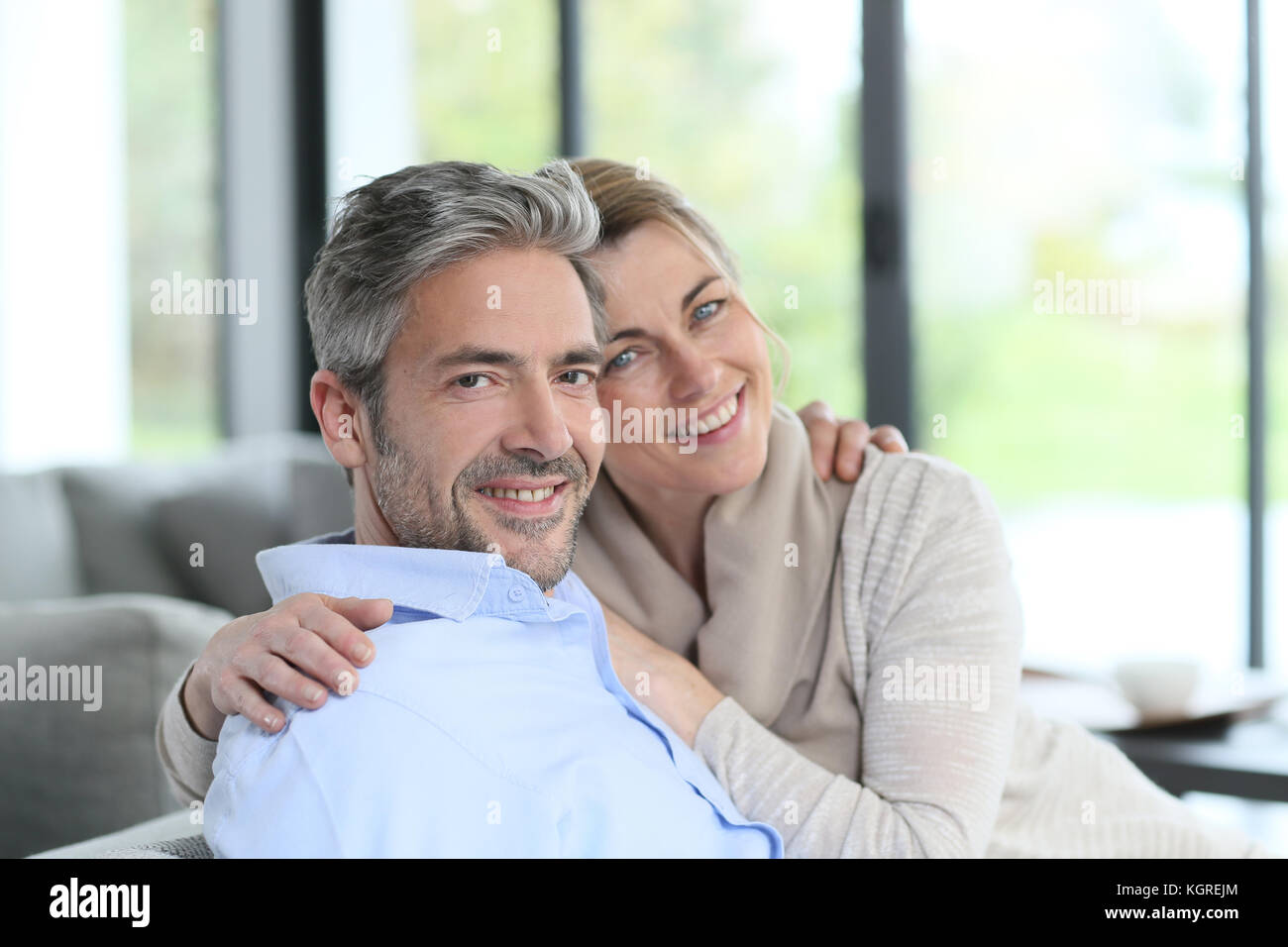 Portrait of mature couple relaxing at home Stock Photo - Alamy