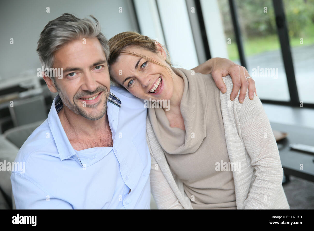 Portrait of mature couple relaxing at home Stock Photo - Alamy