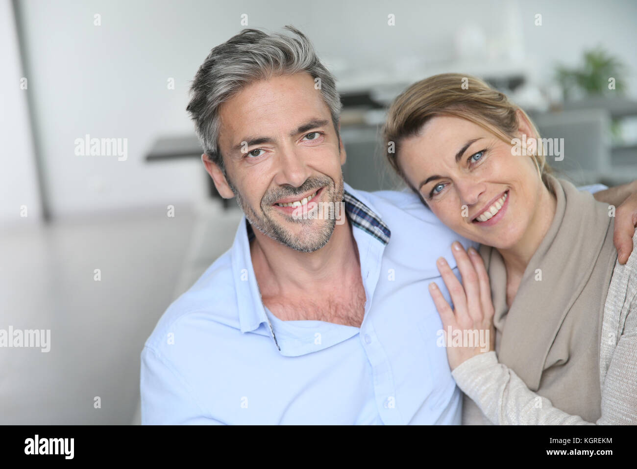 Portrait of mature couple relaxing at home Stock Photo - Alamy