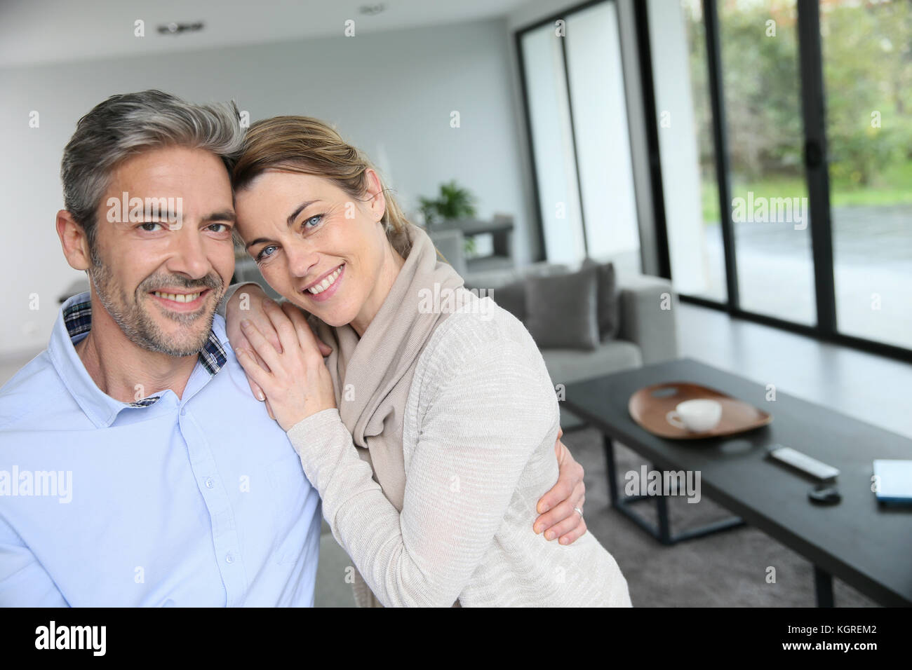 Portrait of mature couple relaxing at home Stock Photo - Alamy